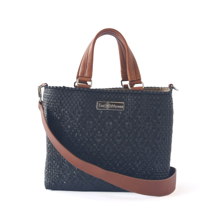 All black woven crossbody drawstring bag with tan leather — handmade from recycled plastic, Tin Marin