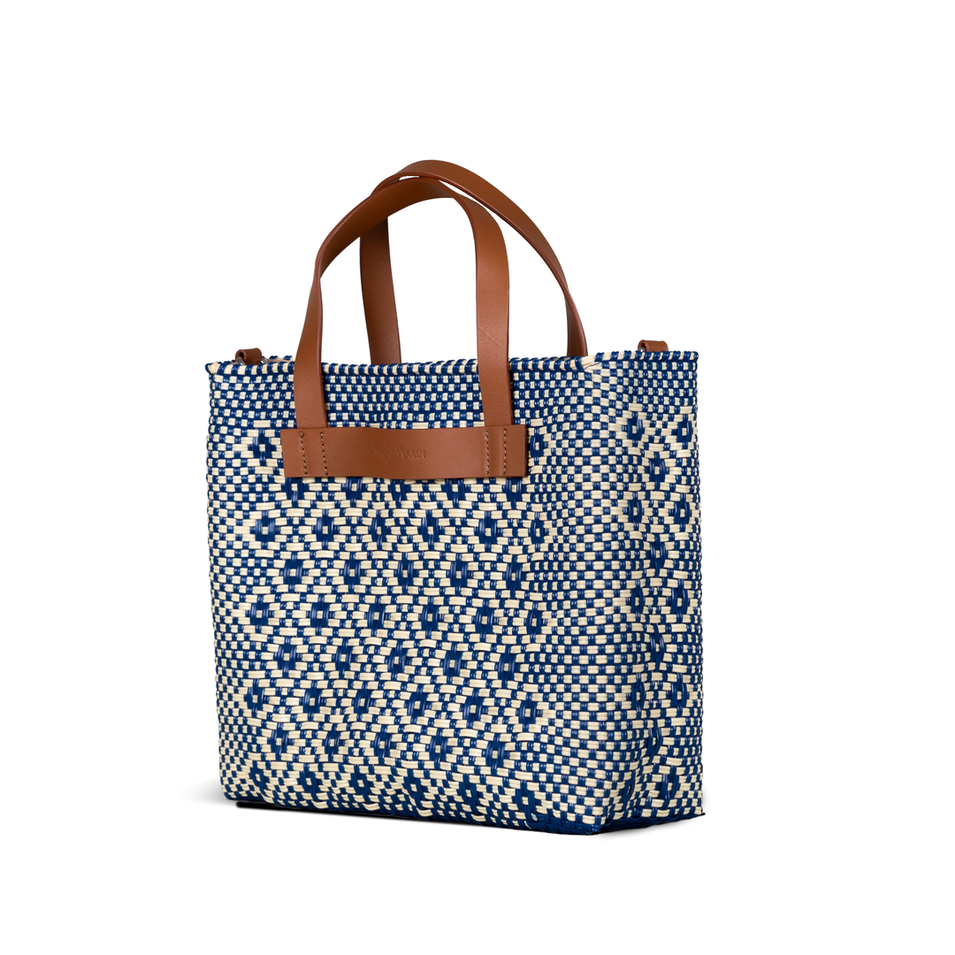 Side angle Mixte large woven crossbody bag in beige and blue with tan leather— handmade from recycled plastic in Mexico by Tin Marin
