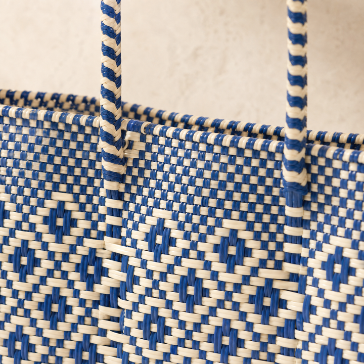 Close-up of handwoven beige and blue Mixte Super Tote by Tin Marin