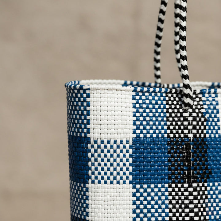 Close-up of handwoven black, white and blue Super Tote by Tin Marin