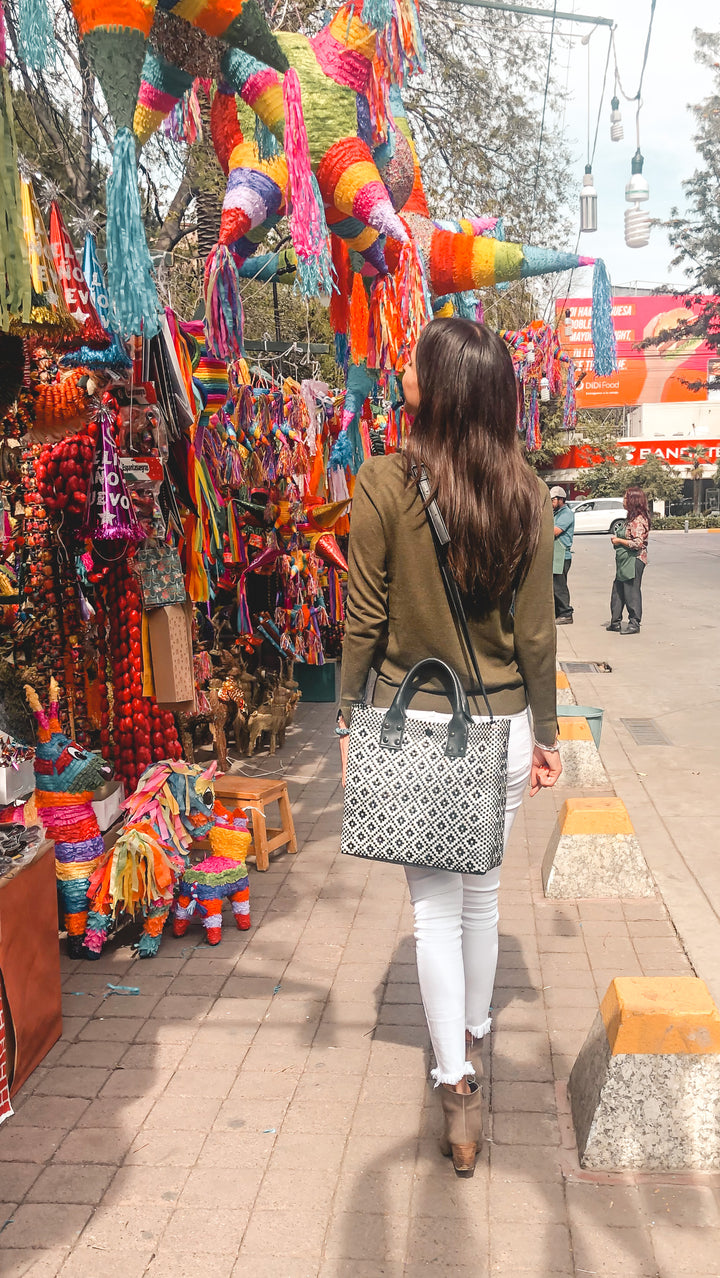 woman wearing large crossbody bag by Tin Marin