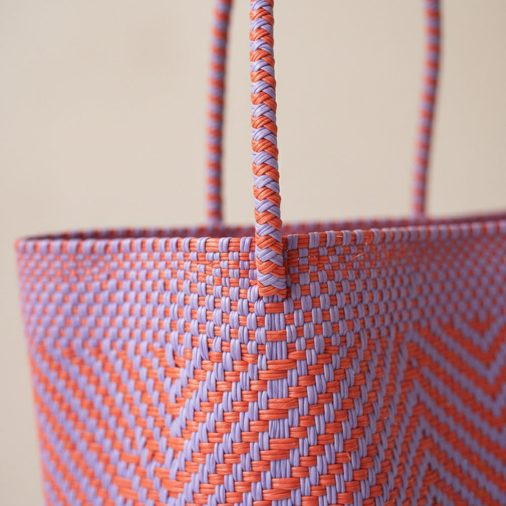 Close-up of handwoven orange and purple positano Super Tote by Tin Marin