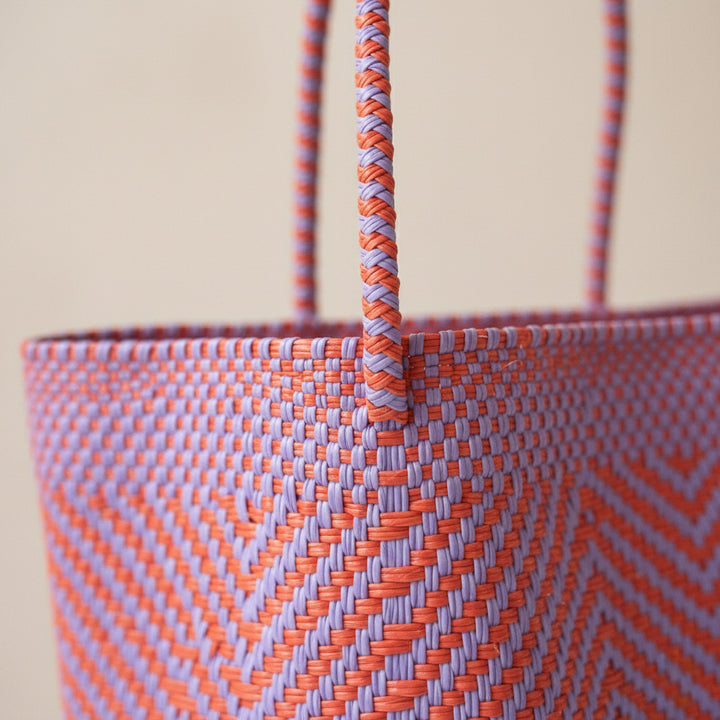 Close-up of handwoven orange and purple positano Super Tote by Tin Marin