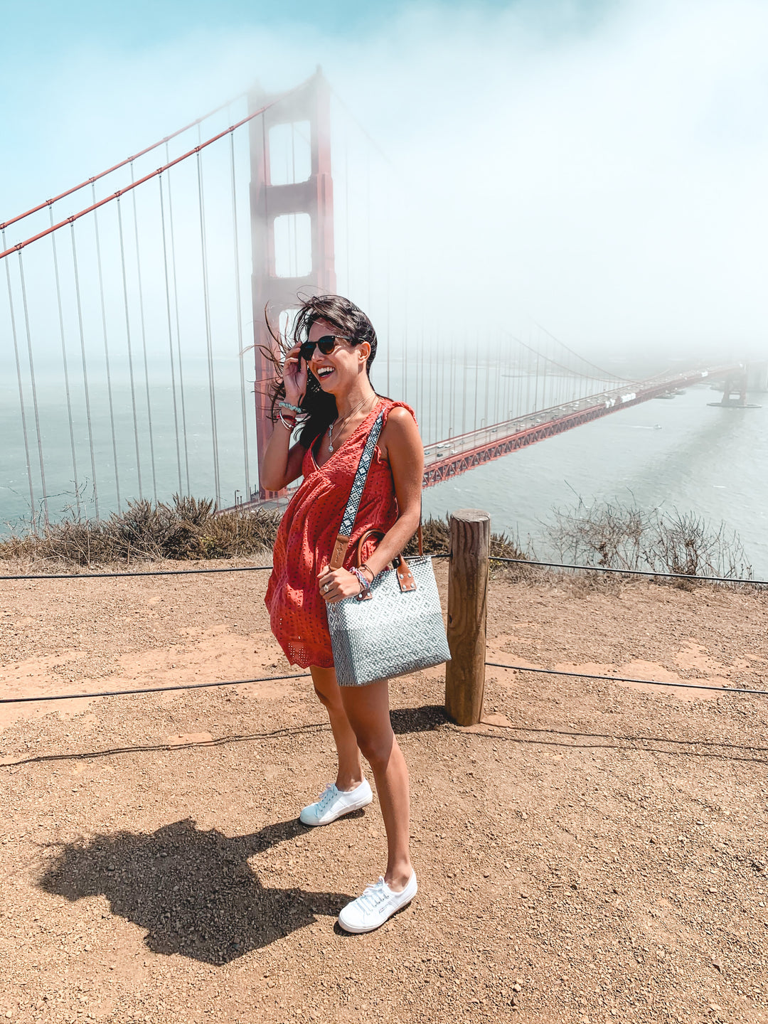 woman wearing large crossbody bag by Tin Marin