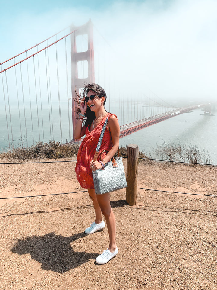 woman wearing large crossbody bag by Tin Marin