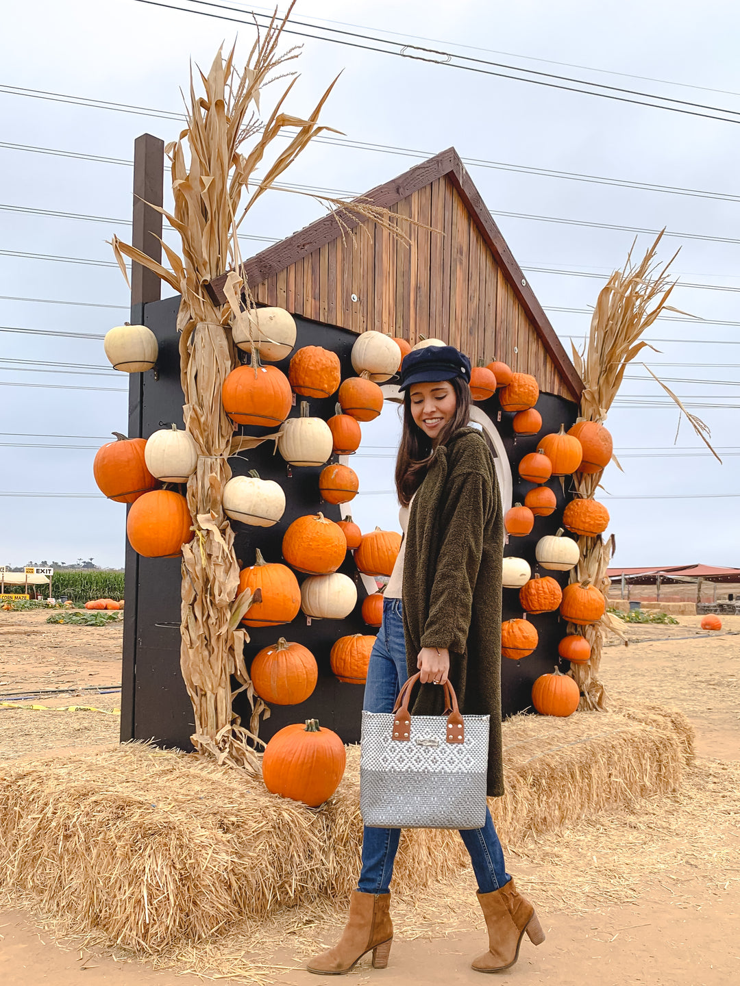 woman wearing large crossbody bag by Tin Marin