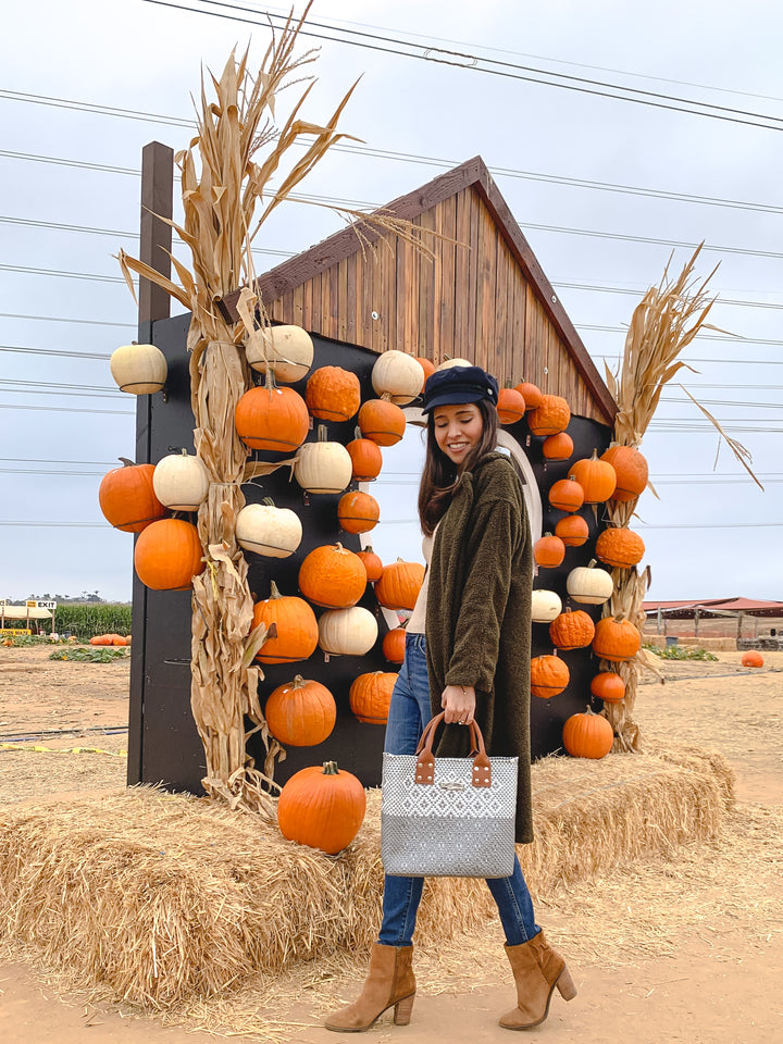 woman wearing large crossbody bag by Tin Marin