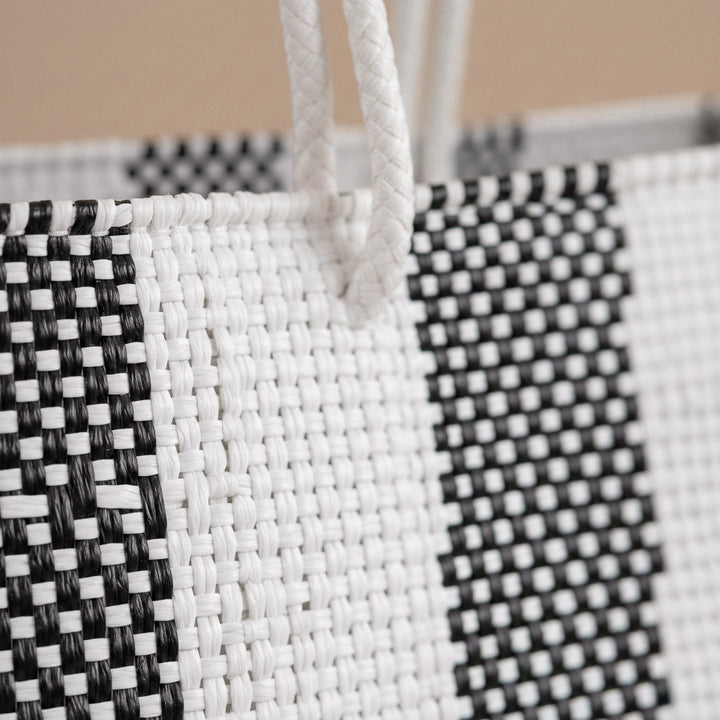 Close-up of handwoven black and white Super Tote by Tin Marin