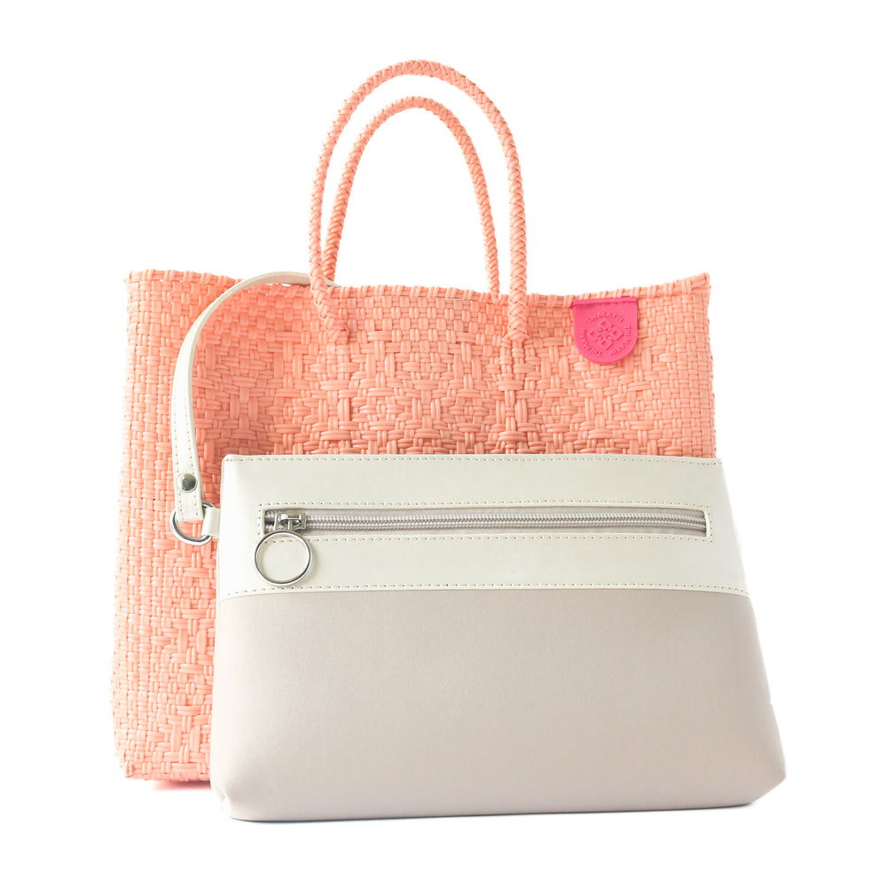 Vallarta medium woven crossbody bag in coral orange with detachable mesh pouch— handmade from recycled plastic in Mexico by Tin Marin