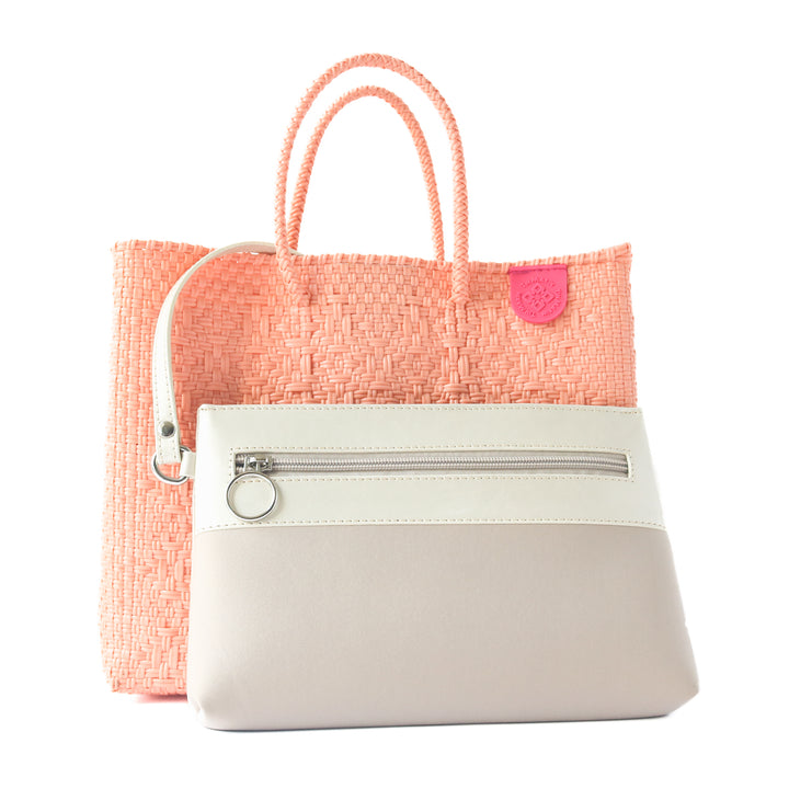 Vallarta medium woven crossbody bag in coral orange with detachable mesh pouch— handmade from recycled plastic in Mexico by Tin Marin