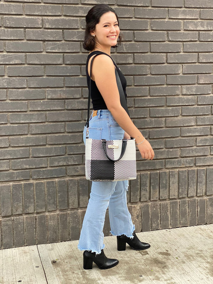 Woman wearing Lucy medium woven crossbody bag — Tin Marin