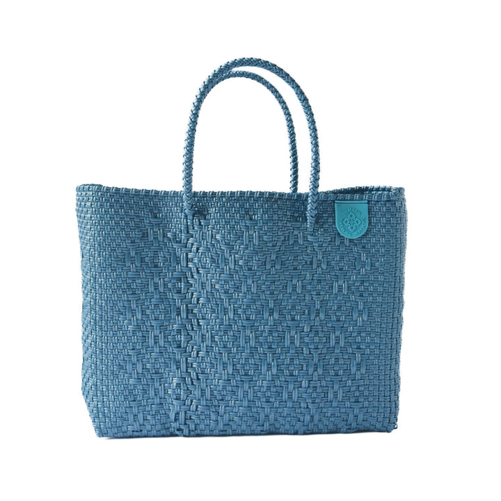 Maui medium woven crossbody bag in blue— handmade from recycled plastic in Mexico by Tin Marin