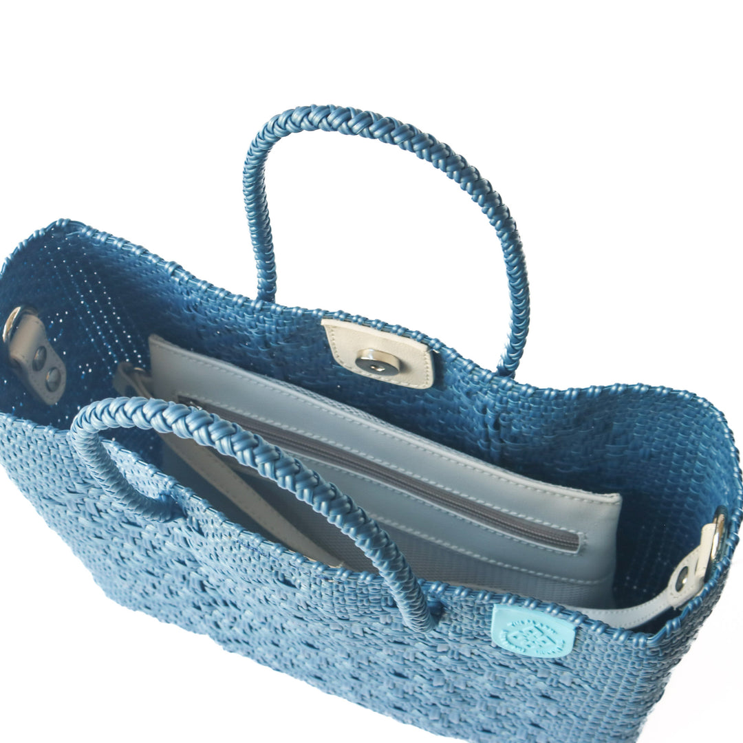 Interior of Maui woven crossbody bag with removable zippered mesh pouch — Tin Marin