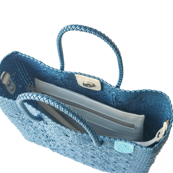 Interior of Maui woven crossbody bag with removable zippered mesh pouch — Tin Marin