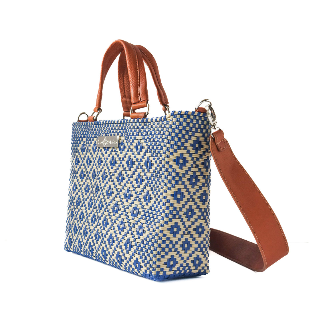 Side Angle Mixte woven crossbody drawstring bag — blue and beige medium bag with tan leather crossbody handmade from recycled plastic, Tin Marin