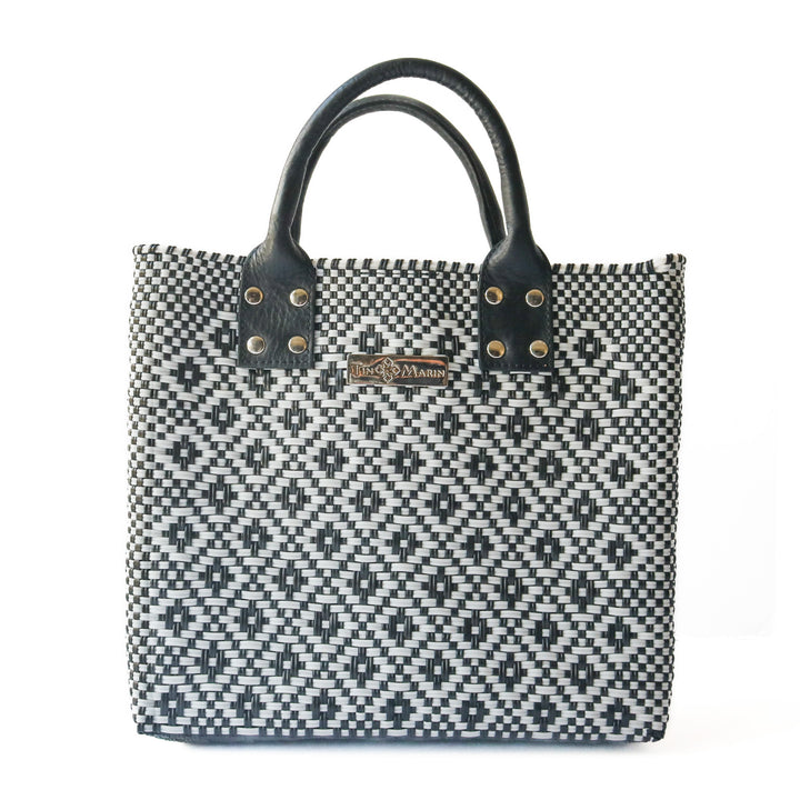 Panda large woven crossbody bag in white and black with black leather— handmade from recycled plastic in Mexico by Tin Marin