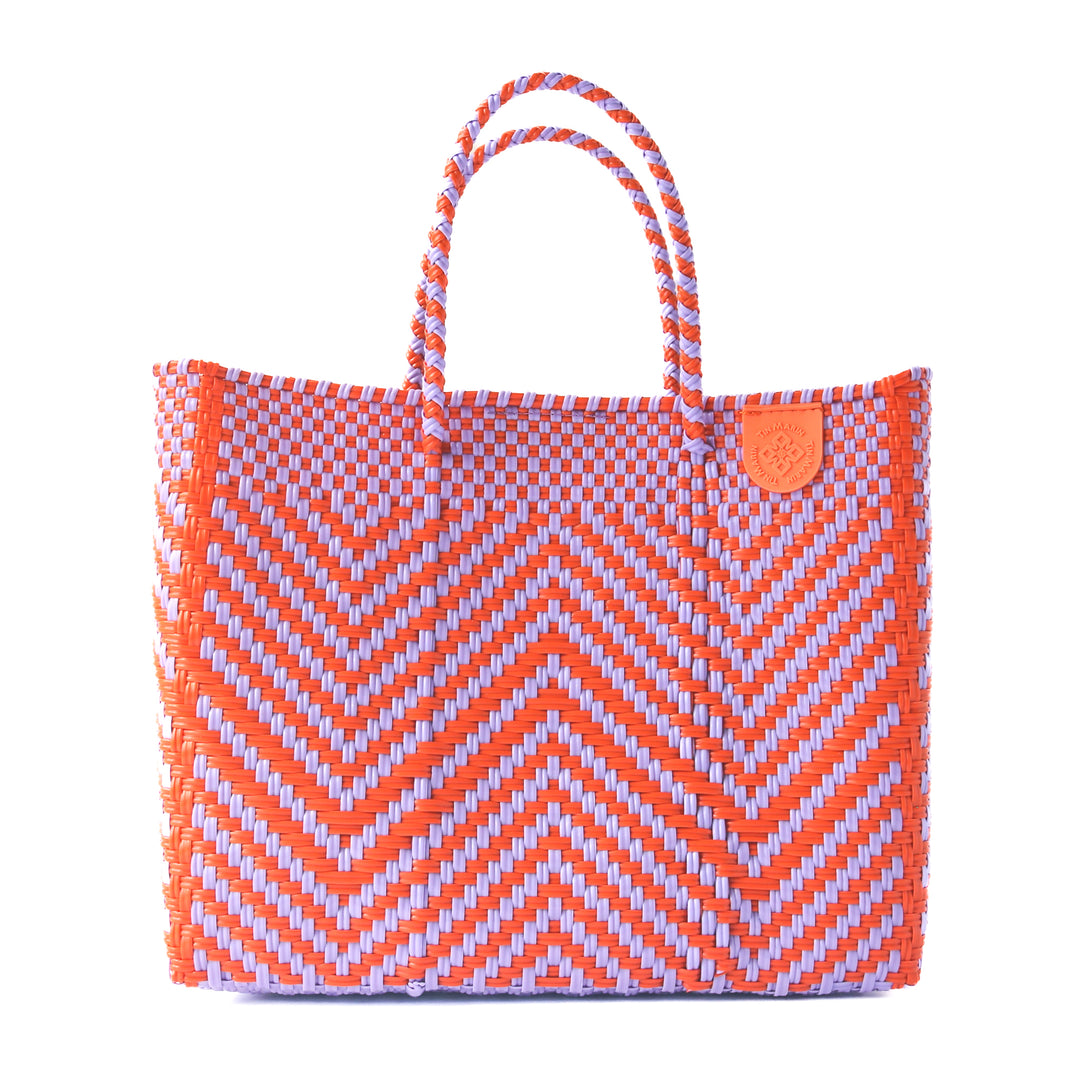 Positano medium woven crossbody bag in orange and purple— handmade from recycled plastic in Mexico by Tin Marin