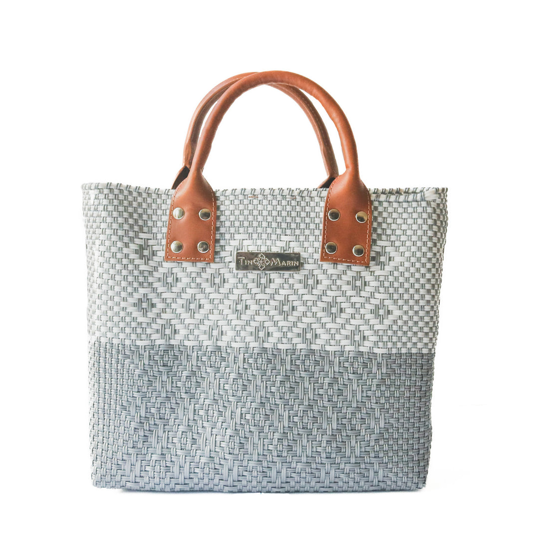 Tin Marin Grey Large woven crossbody bag in white and grey with tan leather— handmade from recycled plastic in Mexico by Tin Marin
