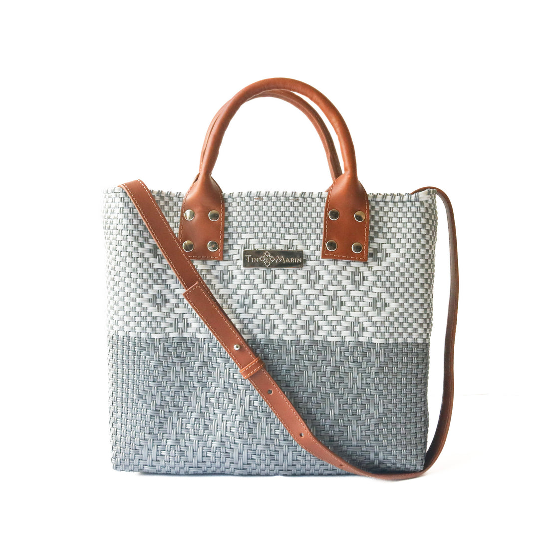Tin Marin Grey Large woven crossbody bag in white and grey with tan leather crossbody strap— handmade from recycled plastic in Mexico by Tin Marin