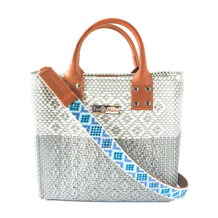 Tin Marin Grey Large woven crossbody bag in white and grey with tan leather and embroidered mai woven strap— handmade from recycled plastic in Mexico by Tin Marin