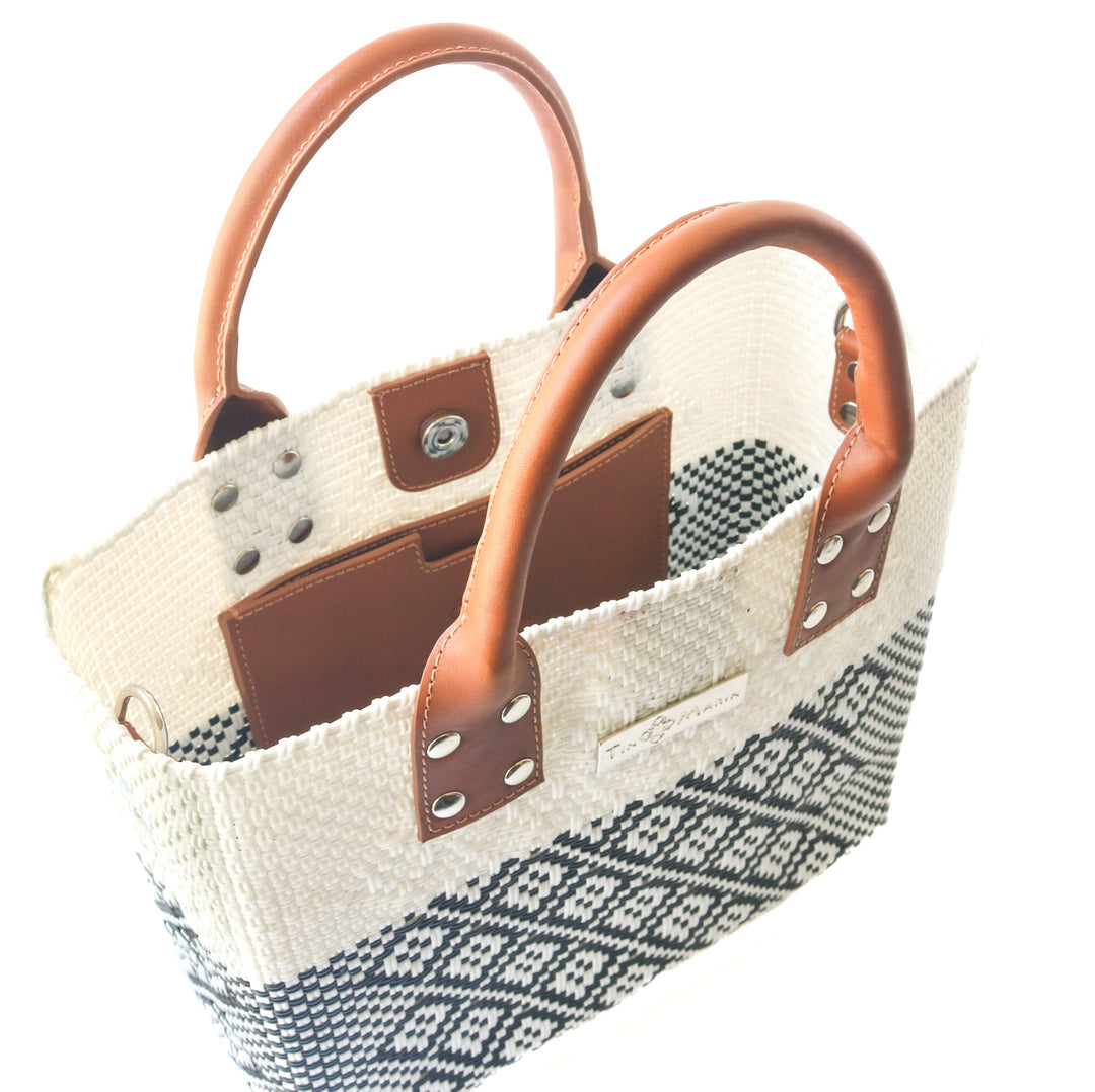 Interior view Tin Marin White Large woven crossbody bag in white and black with tan leather— handmade from recycled plastic in Mexico by Tin Marin