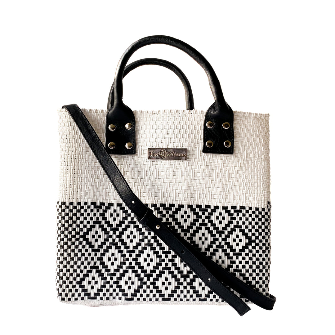 Tin Marin White Large woven crossbody bag in white and black with black leather crossbody strap— handmade from recycled plastic in Mexico by Tin Marin