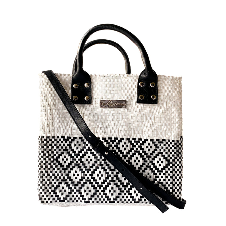 Tin Marin White Large woven crossbody bag in white and black with black leather crossbody strap— handmade from recycled plastic in Mexico by Tin Marin