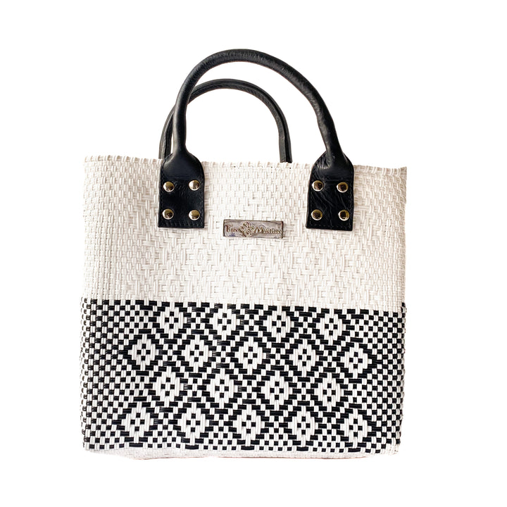 Tin Marin White Large woven crossbody bag in white and black with black leather — handmade from recycled plastic in Mexico by Tin Marin