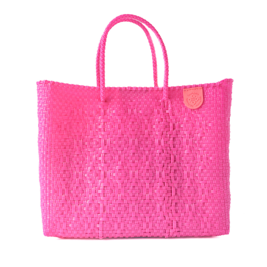 Vallarta medium woven crossbody bag in pink— handmade from recycled plastic in Mexico by Tin Marin