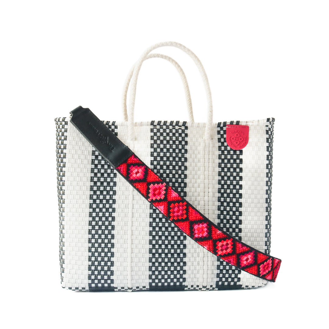 Zebra medium woven crossbody bag in black and white— handmade from recycled plastic in Mexico by Tin Marin with embroidered mai woven strap